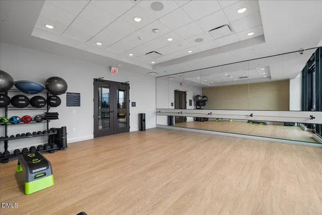 a view of a patio with dining table and chairs with wooden fence