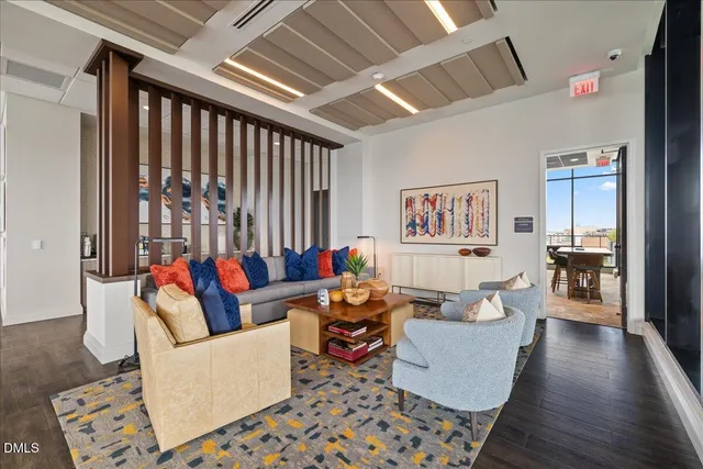 a dining room with furniture window and wooden floor