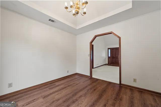 a kitchen with stainless steel appliances granite countertop a refrigerator and a stove