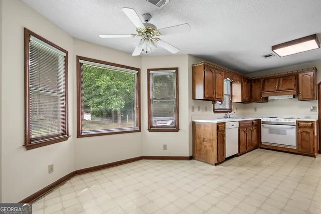 a bathroom with a sink a toilet and a bathtub