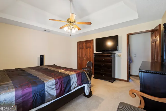 a bathroom with a double vanity sink toilet and mirror