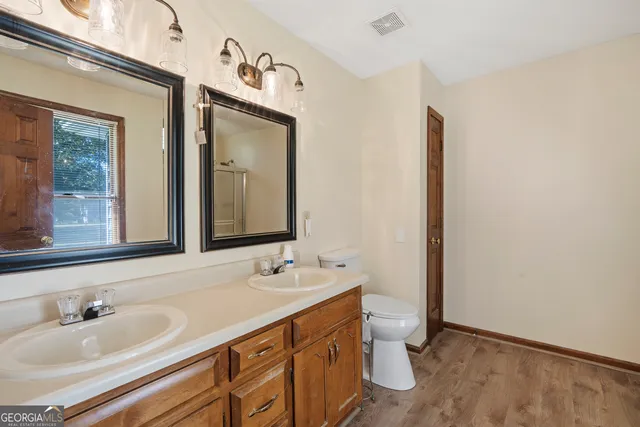 a bedroom with furniture and a large window