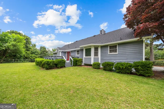 a view of a backyard of the house