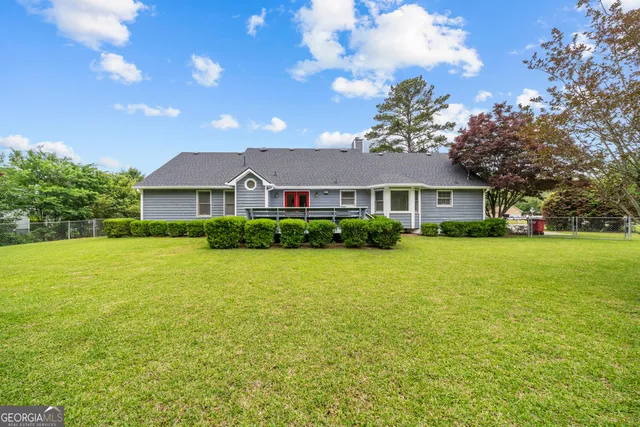 a view of balcony with wooden floor and fence