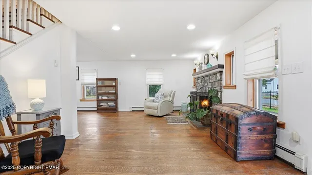 a living room with furniture and a fireplace