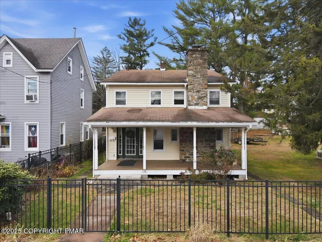 a view of a car parked in front of a house