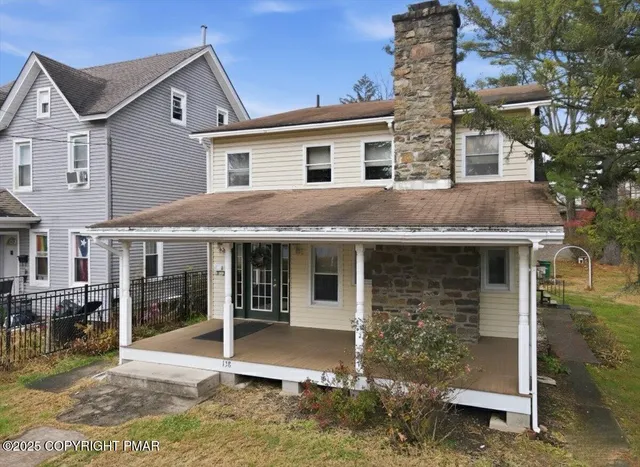 a view of a livingroom with furniture and a piano