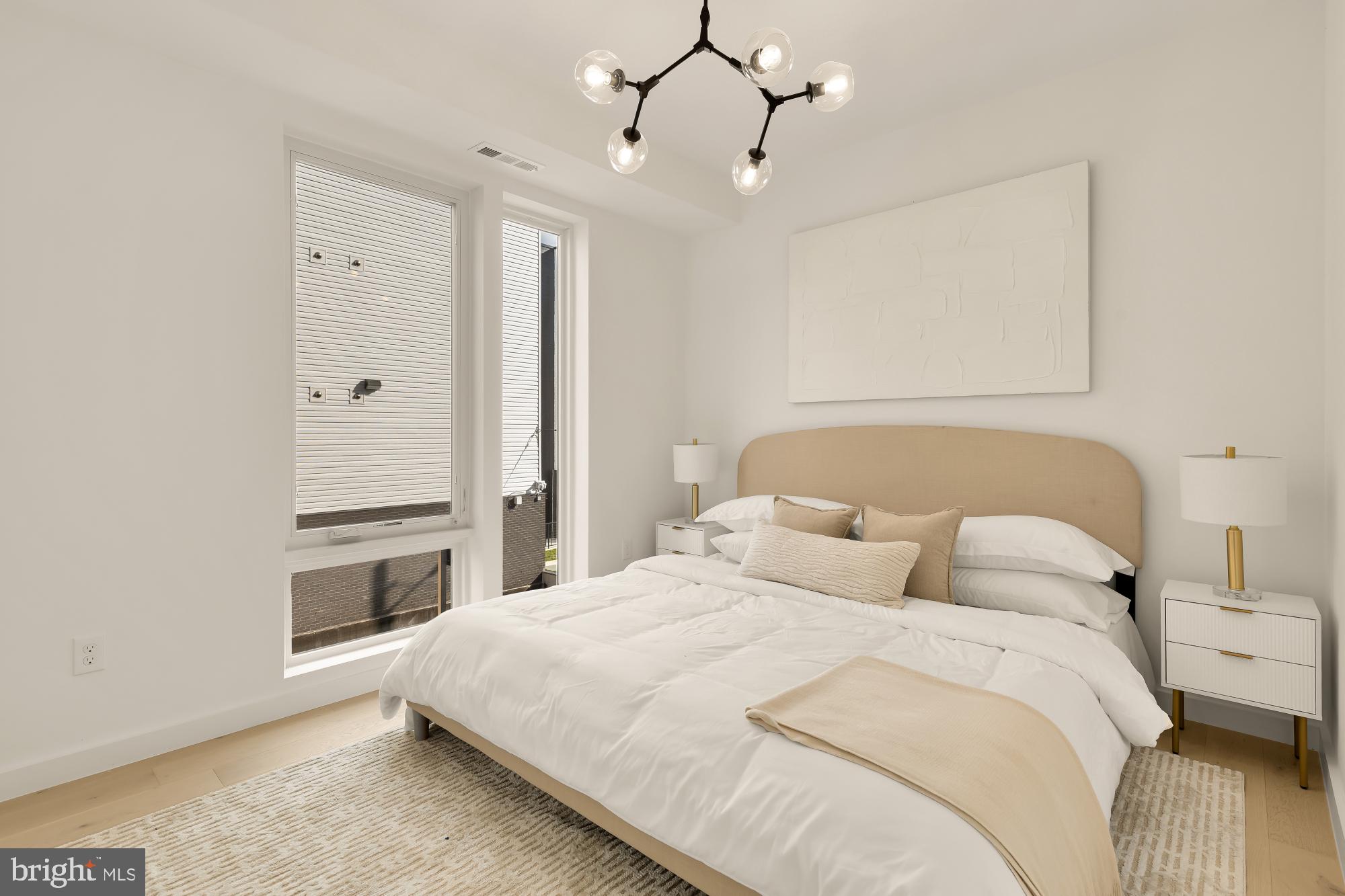 30 Kennedy Street Northwest, Unit 6 Washington, DC 20011 - Photo 16 of 35 a bedroom with a bed and a chandelier