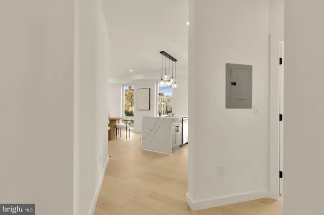 a view of living room with furniture and mirror