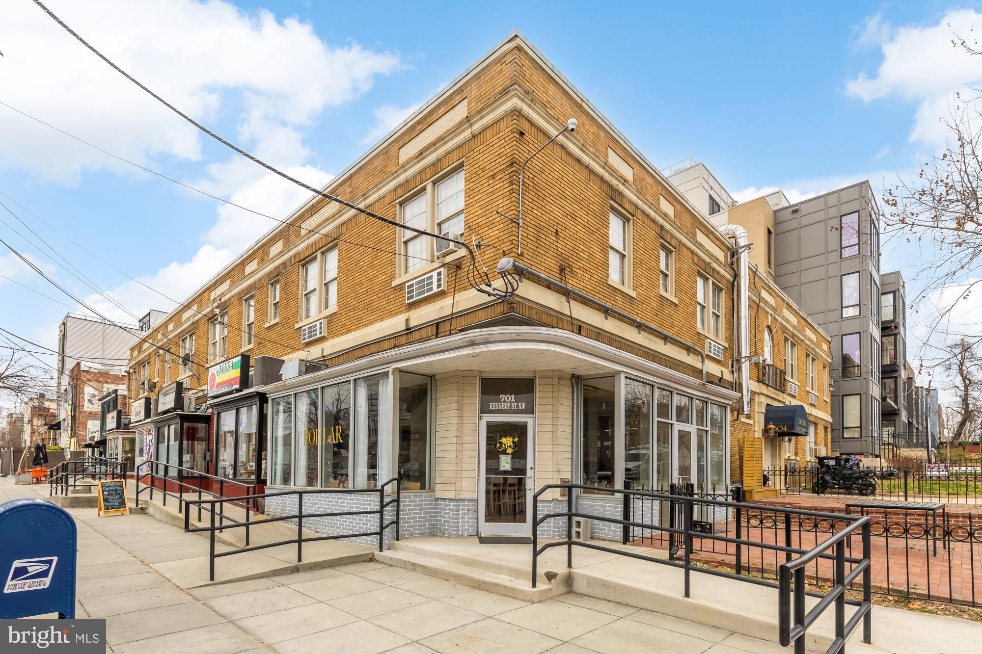 30 Kennedy Street Northwest, Unit 6 Washington, DC 20011 - Photo 33 of 35 a view of a building with a bench