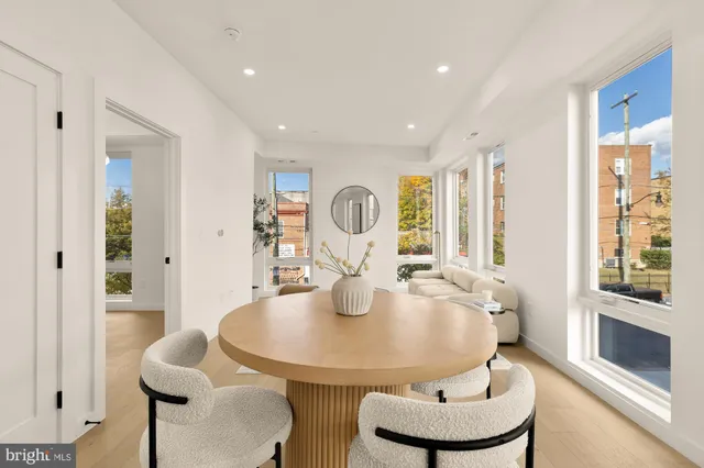 a dining room with furniture and a chandelier