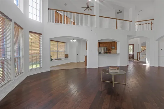 a view of livingroom with furniture wooden floor and windows