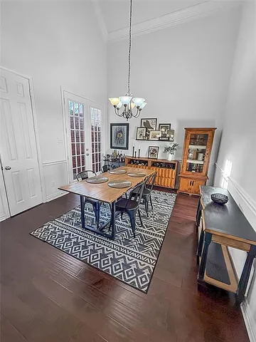 a dining room with furniture a rug and wooden floor