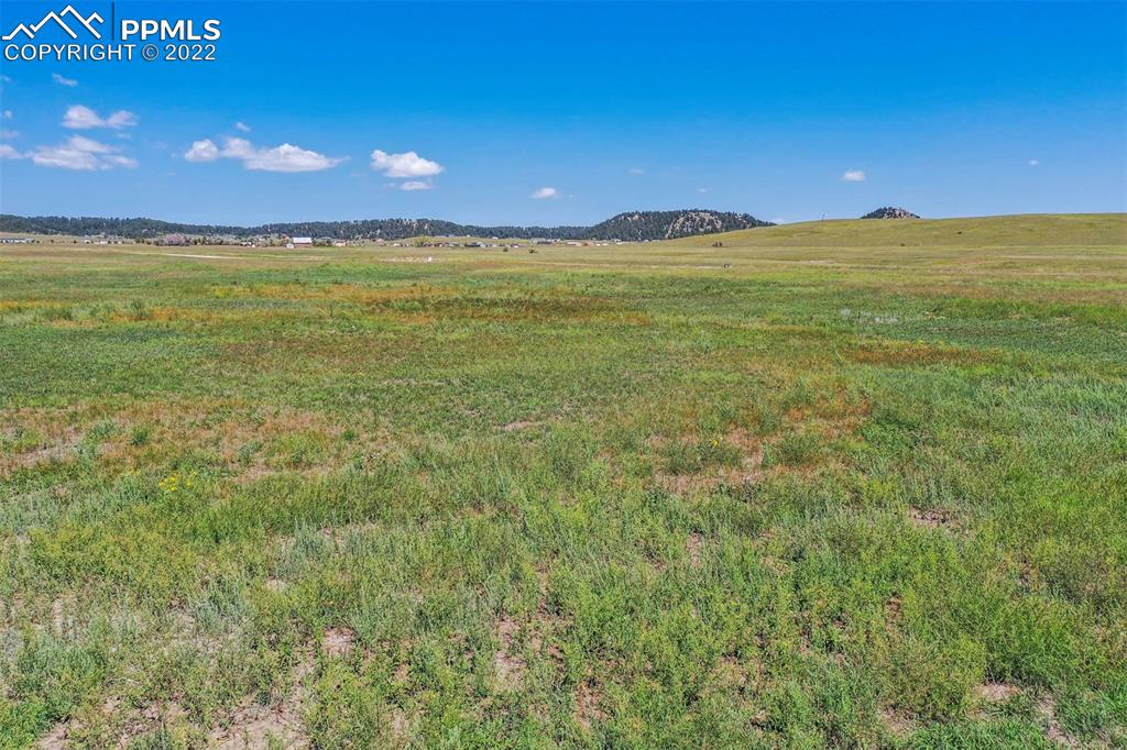 14775 Tiboria Loop Peyton, CO 80831 - Photo 16 of 20 a view of an ocean beach and a mountain