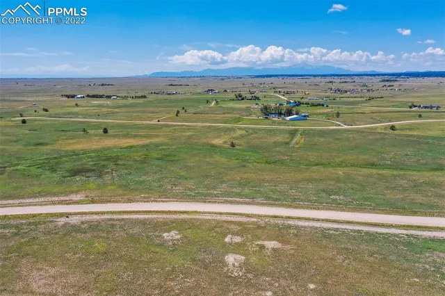 a view of field with ocean view