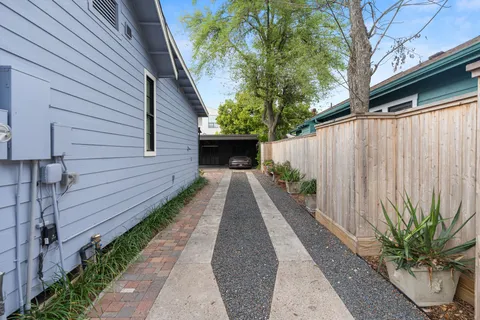 a view of a pathway with a backyard