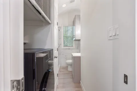 a bathroom with a toilet and a shower