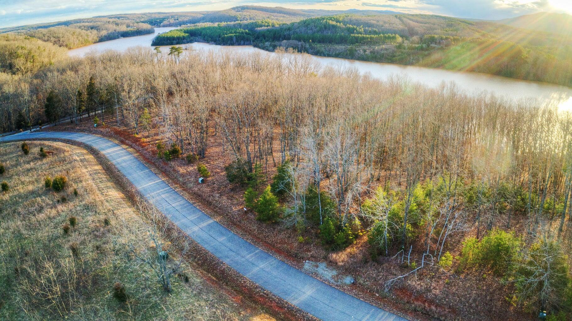 Lot 6 Robin Ridge Court Pittsville, VA 24139 - Photo 11 of 14 a view of a lake from a yard