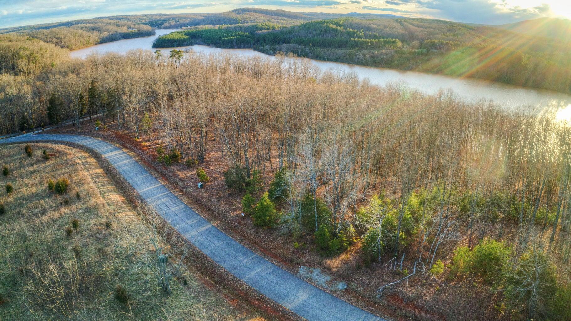 Lot 6 Robin Ridge Court Pittsville, VA 24139 - Photo 12 of 14 a view of a lake from a yard