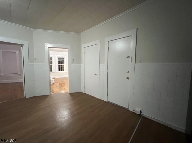 234 Christine Street, Unit 2F Elizabeth, NJ 07202 - Photo 3 of 11 wooden floor in an empty room