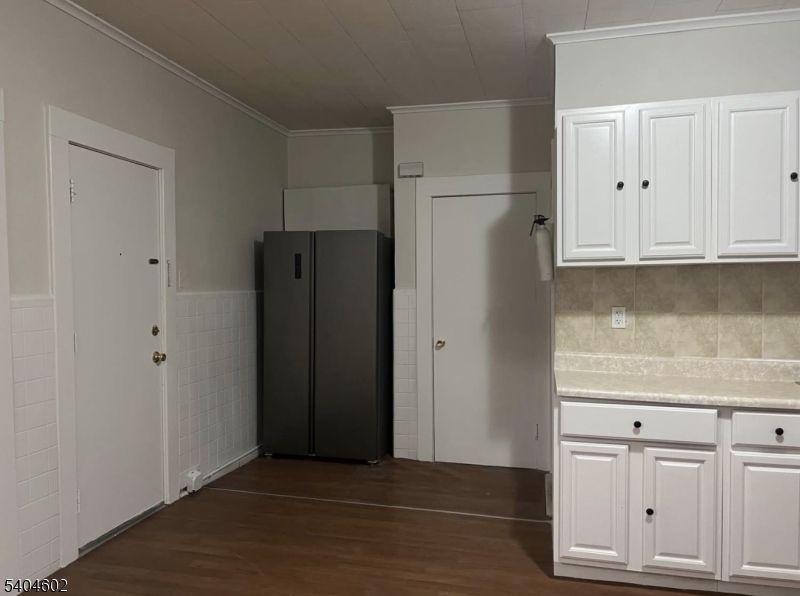 234 Christine Street, Unit 2F Elizabeth, NJ 07202 - Photo 4 of 11 a view of cabinets and wooden floor