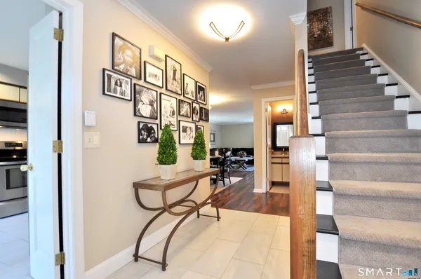 a view of entryway and hall with dining room