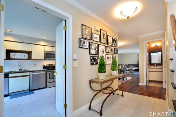 a view of a livingroom with furniture and a kitchen