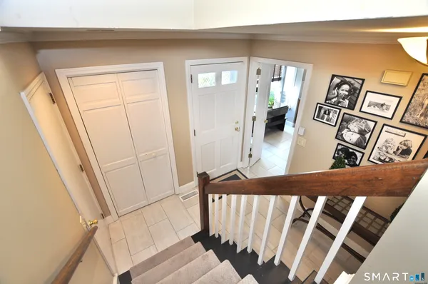 a view of a living room and a baby crib