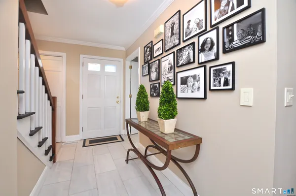 a view of a hallway with seating area and furniture
