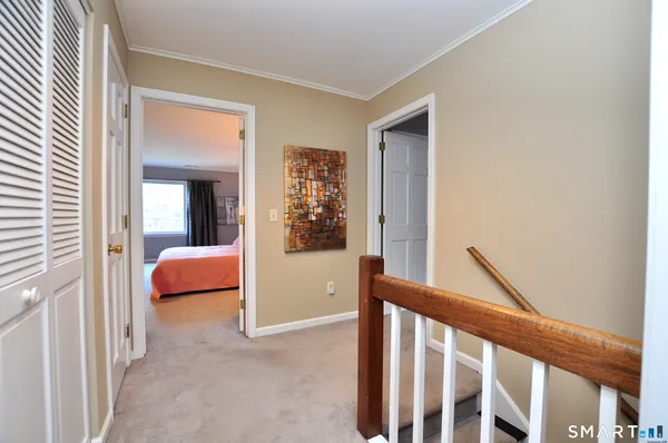 a view of a bedroom with furniture and windows