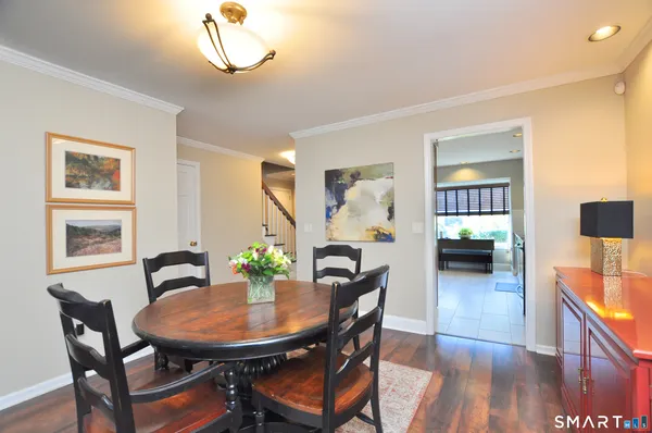 a view of a dining room with furniture and wooden floor