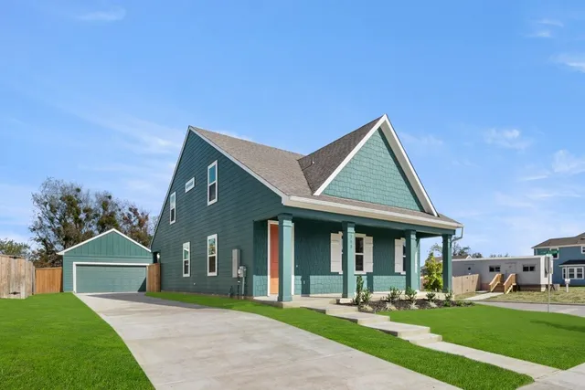 a front view of a house with a yard table and chairs