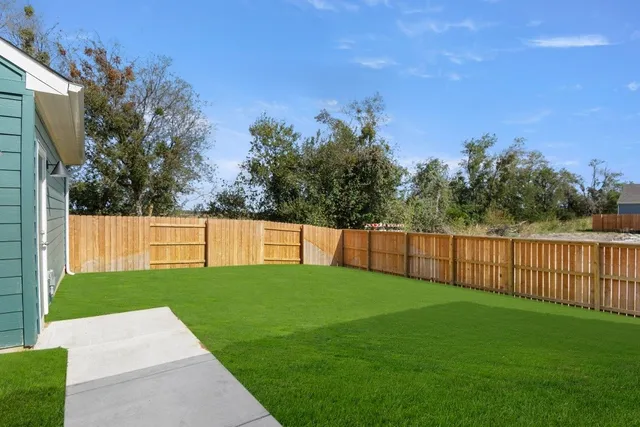 a view of a backyard with a small cabin