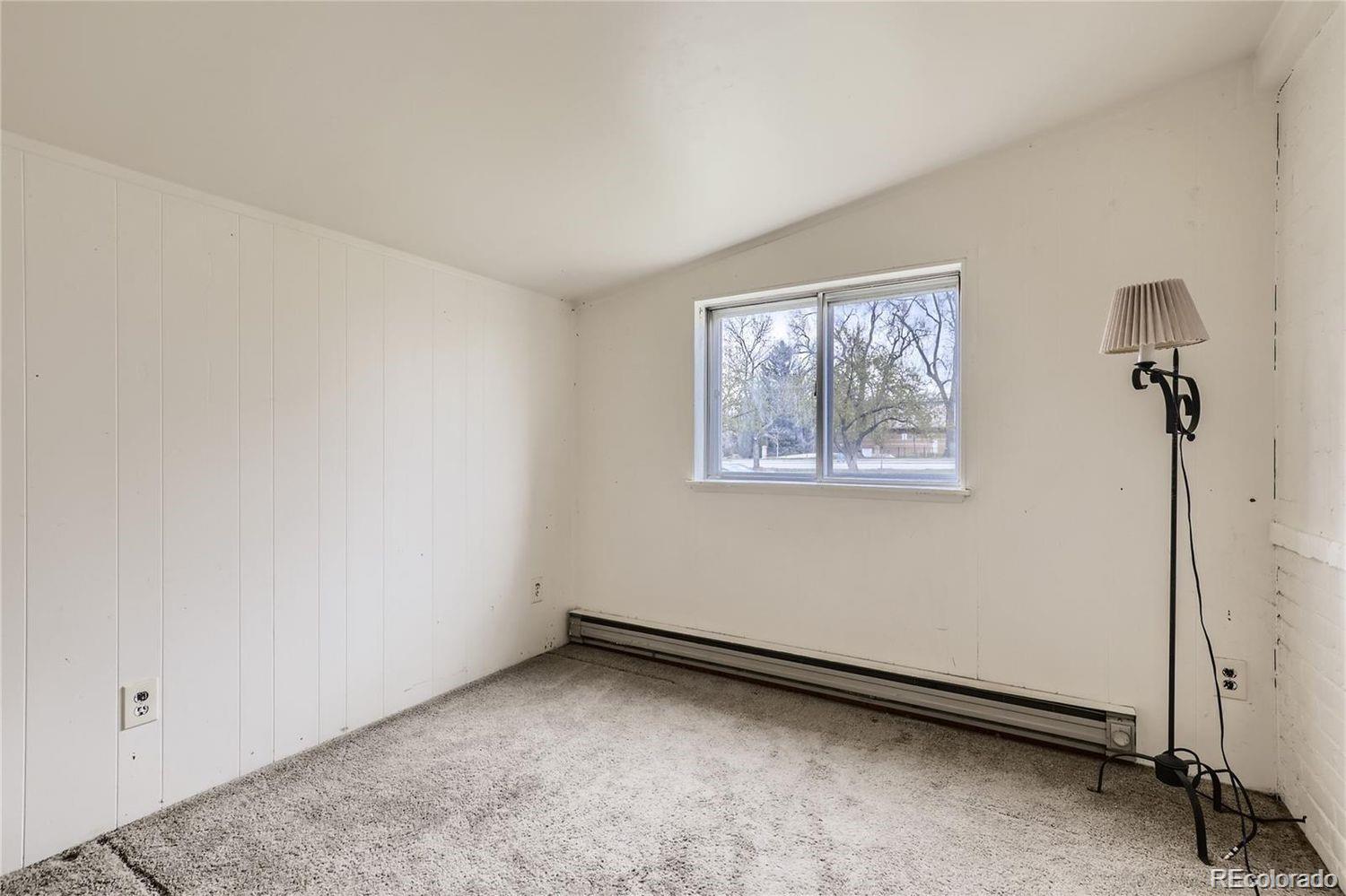 411 Quebec Street Denver, CO 80220 - Photo 15 of 31 a view of an empty room with a window