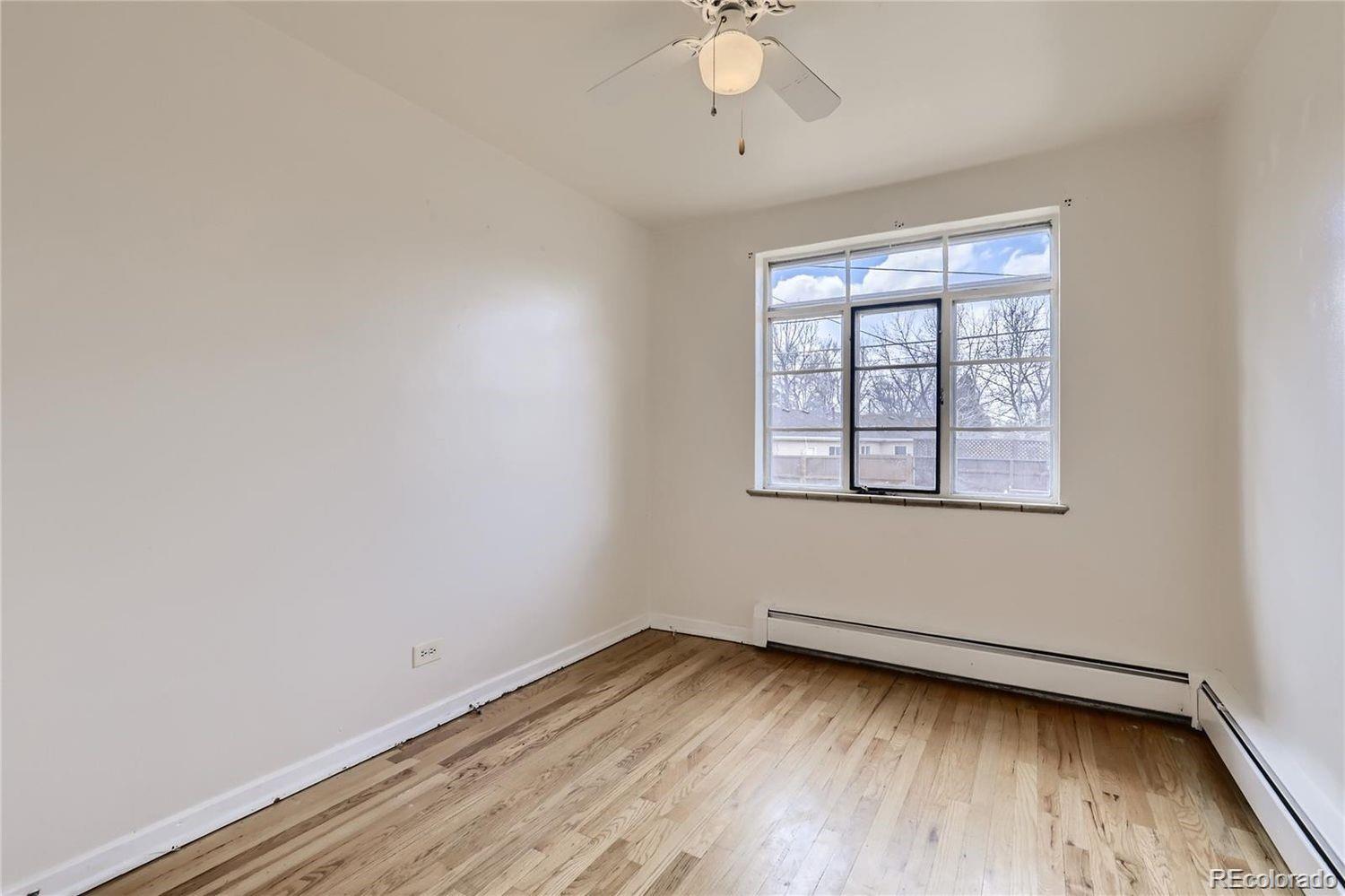 411 Quebec Street Denver, CO 80220 - Photo 17 of 31 an empty room with a window
