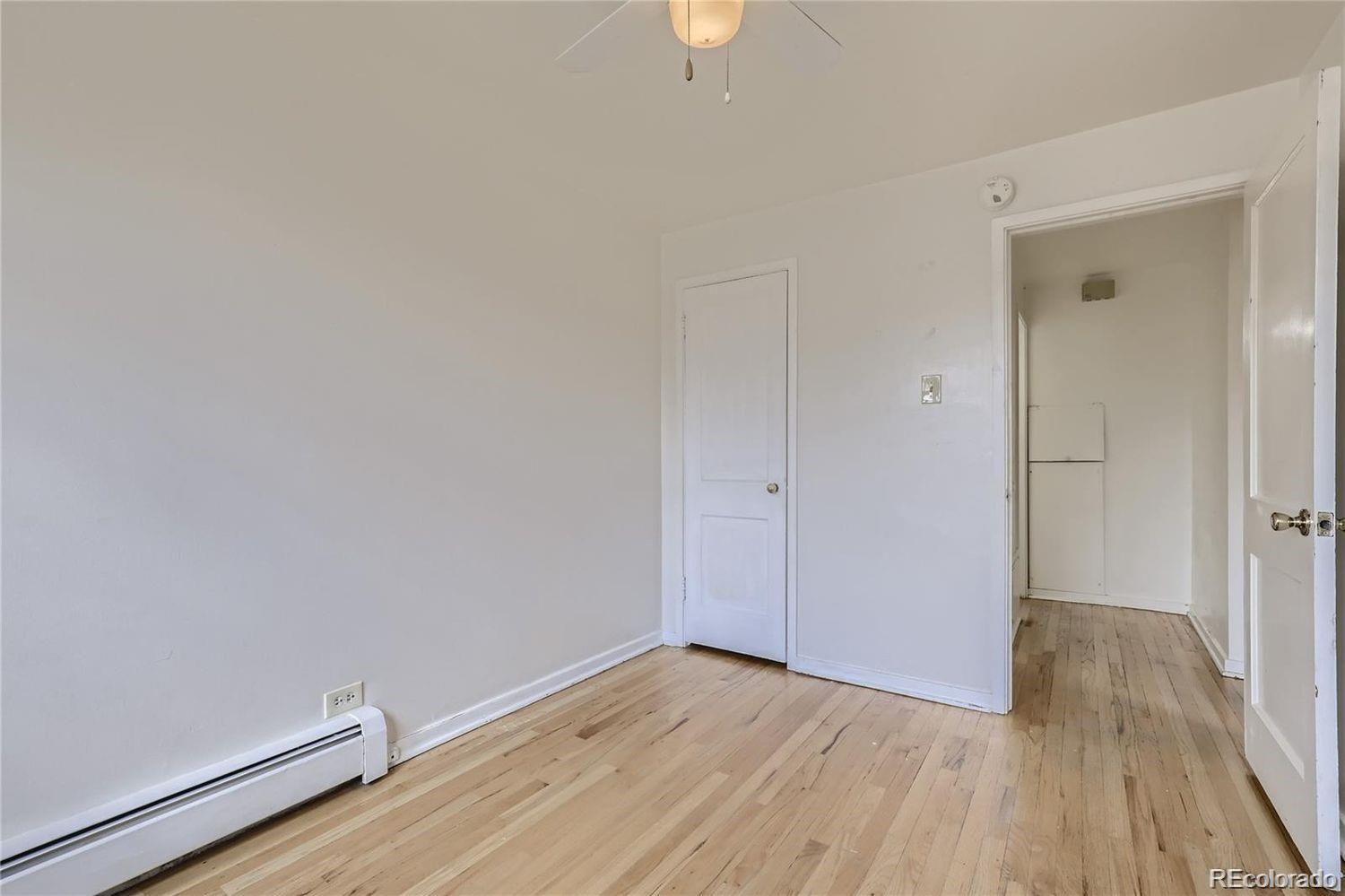 411 Quebec Street Denver, CO 80220 - Photo 19 of 31 a view of room with wooden floor