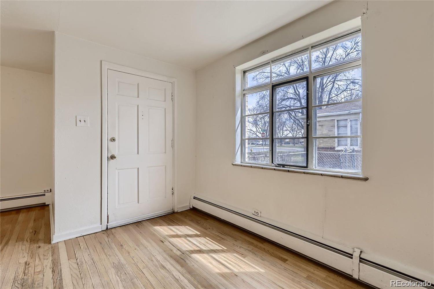 411 Quebec Street Denver, CO 80220 - Photo 21 of 31 wooden floor in an empty room with a window