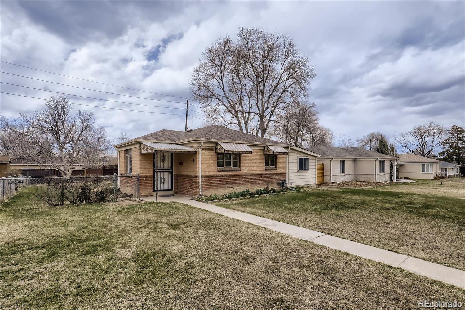 411 Quebec Street Denver, CO 80220 - Photo 26 of 31 a house with trees in front of it
