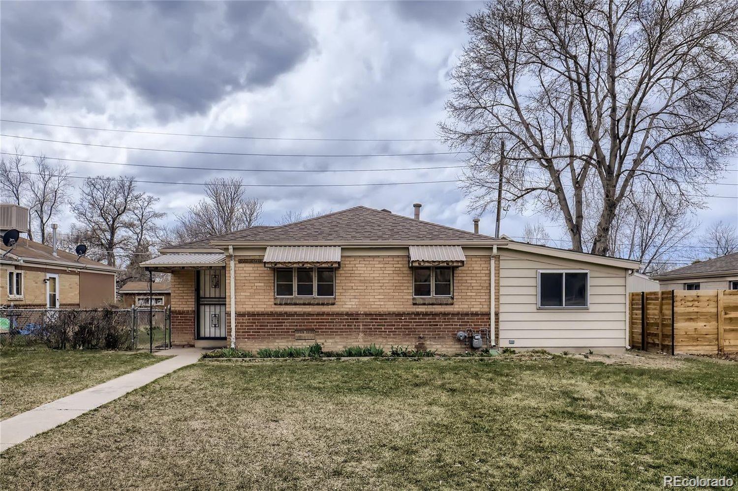 411 Quebec Street Denver, CO 80220 - Photo 30 of 31 a view of a house with a yard