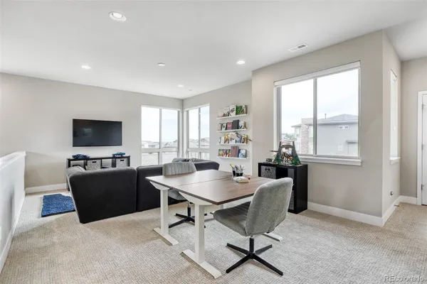 a bed room with a bed and a chair