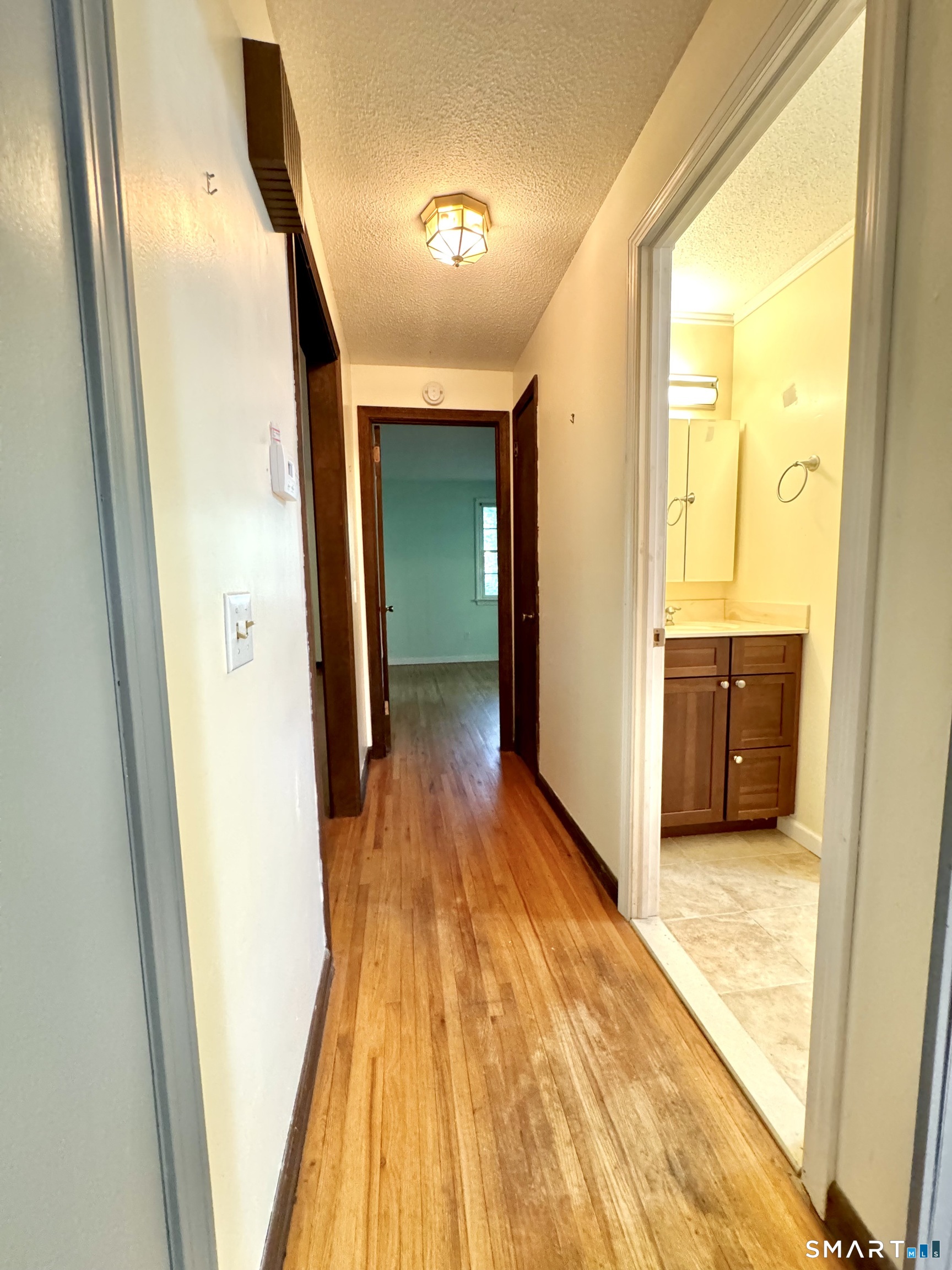 24 Old Simsbury Road Granby, CT 06035 - Photo 15 of 39 First floor hallway from Kitchen