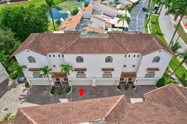 a view of a patio with table and chairs and potted plants