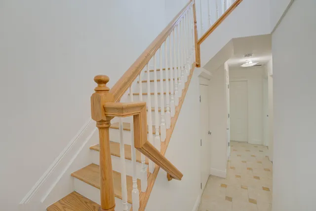 an empty room with a window and bathroom