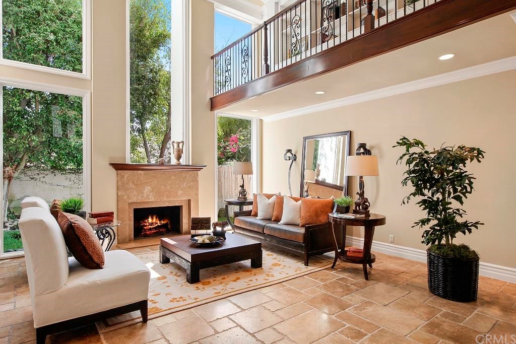 2 Rue Chamonix Newport Beach, CA 92660 - Photo 1 of 1 a living room with furniture and a fireplace