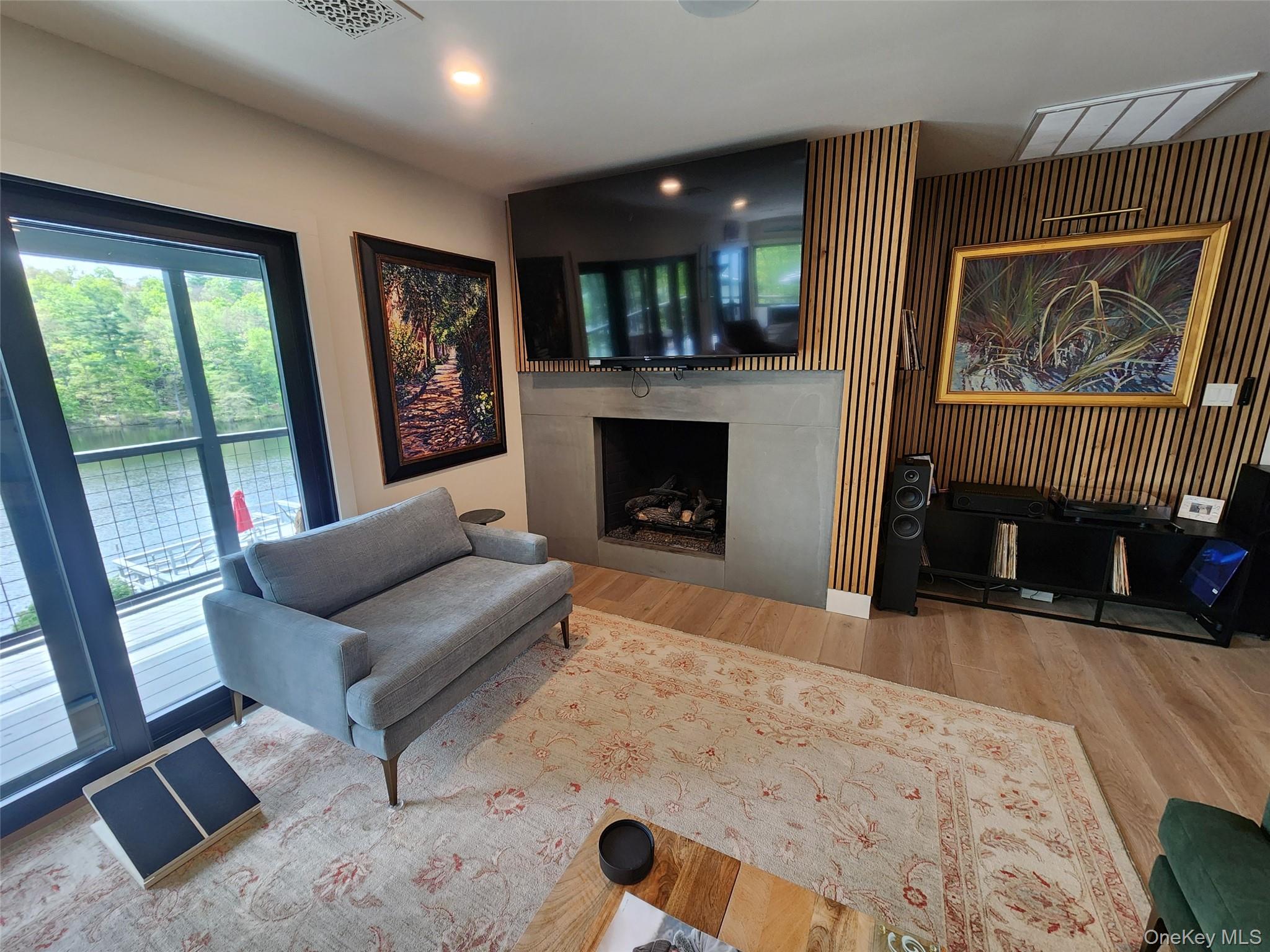 53 Lake Pleasant Road Staatsburg, NY 12580 - Photo 11 of 34 a living room with furniture and a fireplace