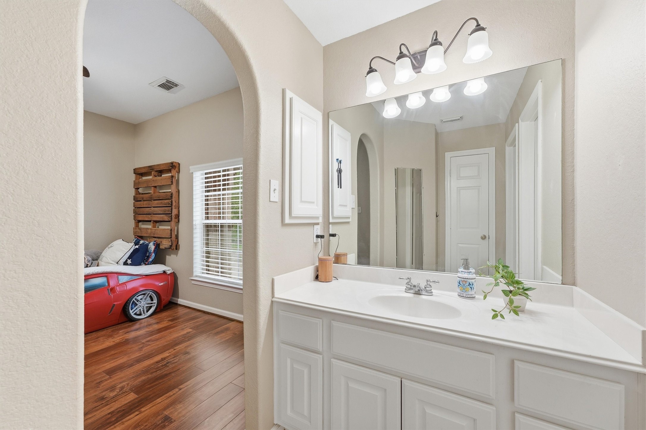 25181 Ramrock Drive Porter, TX 77365 - Photo 17 of 35 a bathroom with a sink double vanity and a mirror
