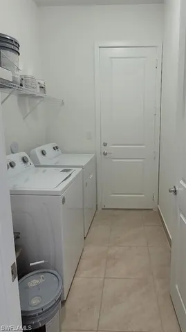 a utility room with a sink a toilet and vanity