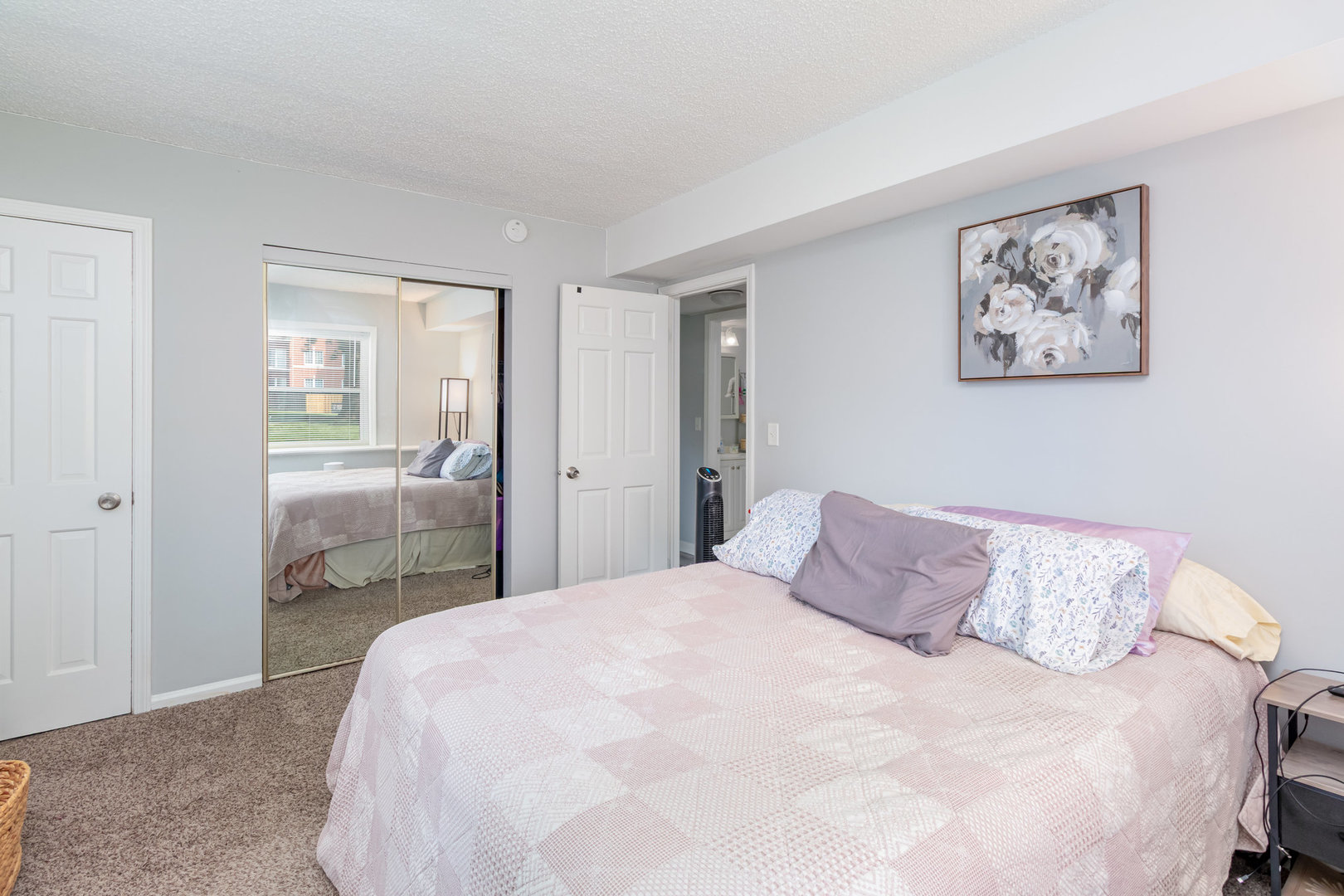 3325 Kirchoff Road, Unit 3C Rolling Meadows, IL 60008 - Photo 7 of 13 a bedroom with a large bed and glass door