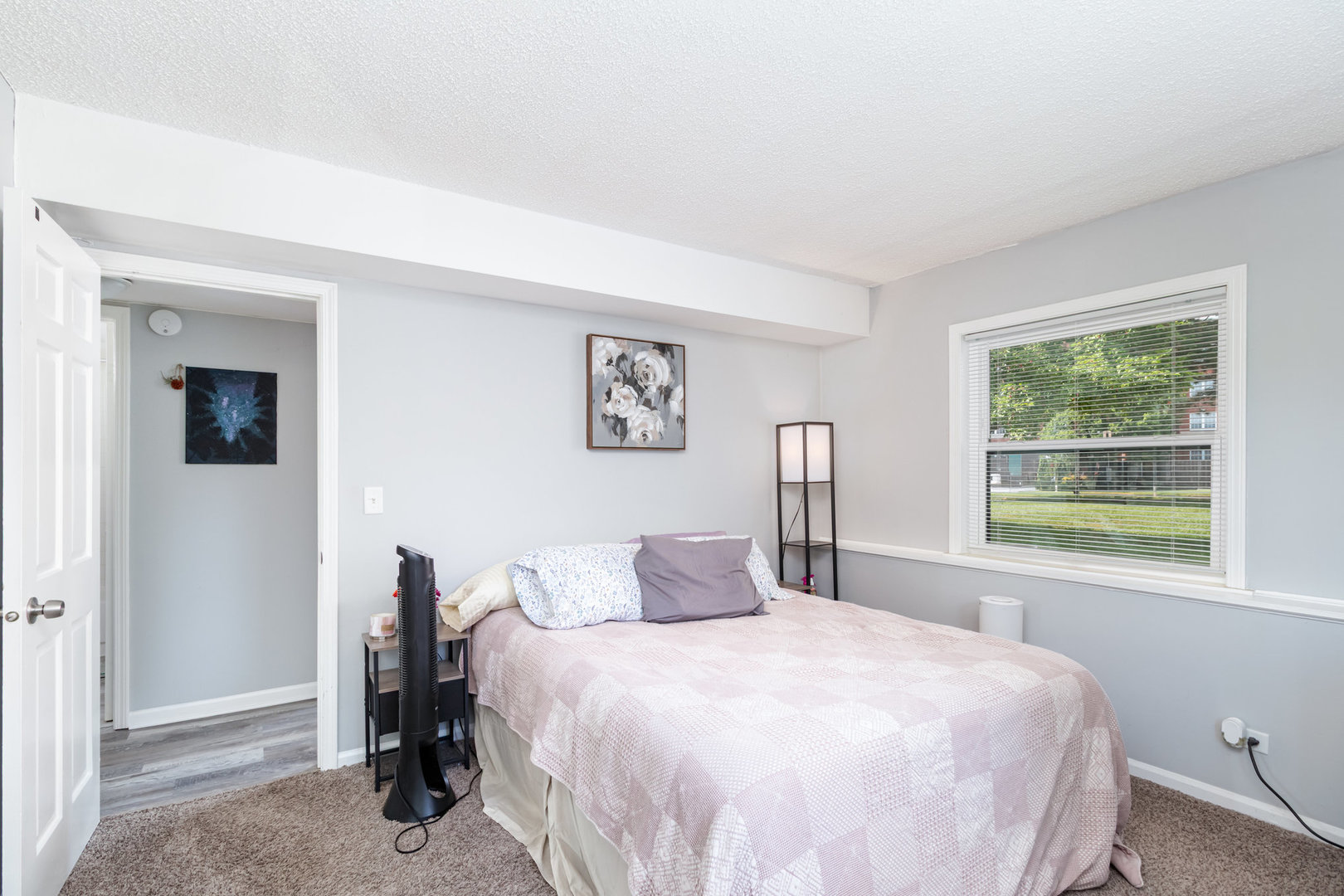 3325 Kirchoff Road, Unit 3C Rolling Meadows, IL 60008 - Photo 8 of 13 a bedroom with a bed and a window