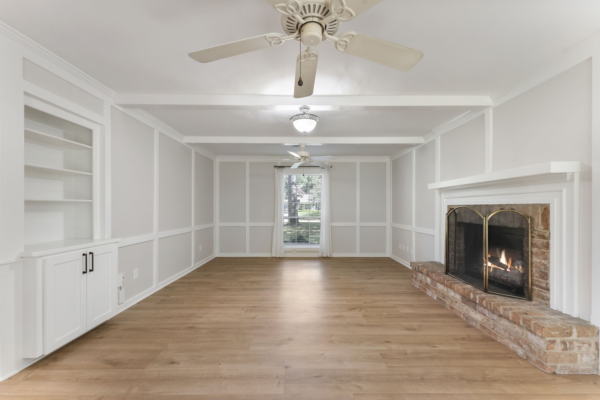 6311 Craigway Road Spring, TX 77389 - Photo 11 of 34 The family room has plenty of space for entertaining or relaxing by the fireplace.